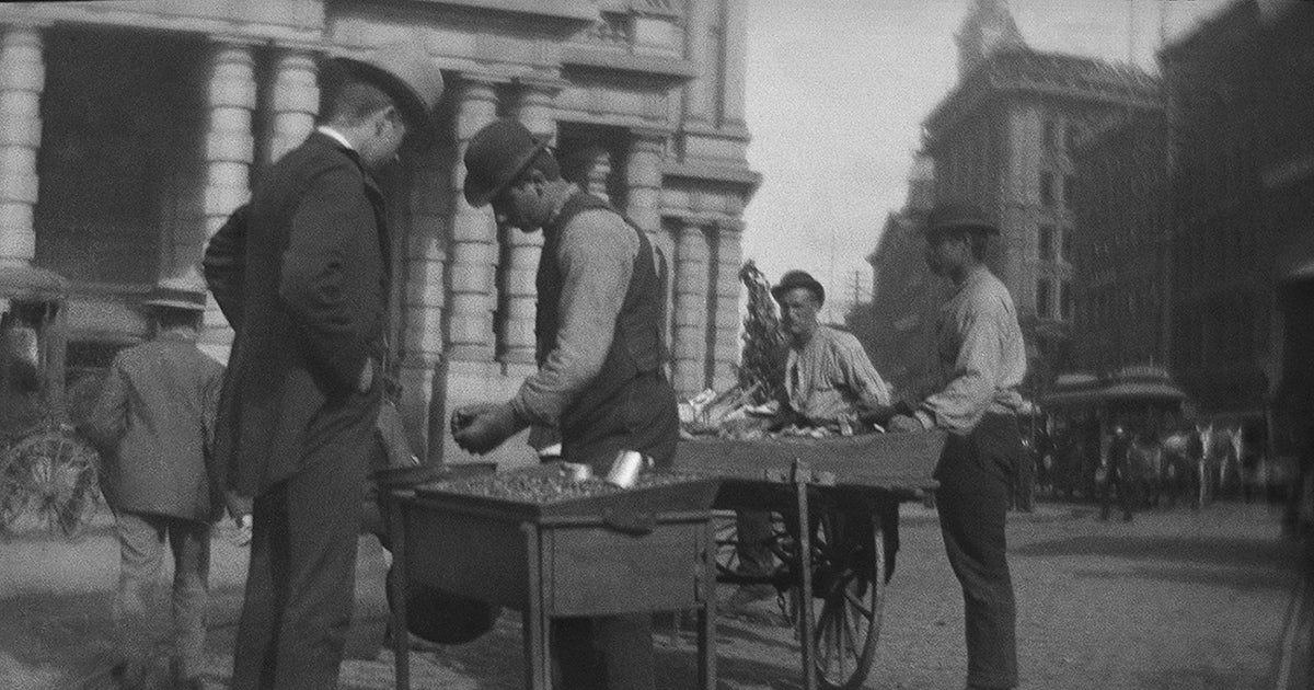 Chestnut vendor on a New York City street, circa 1885